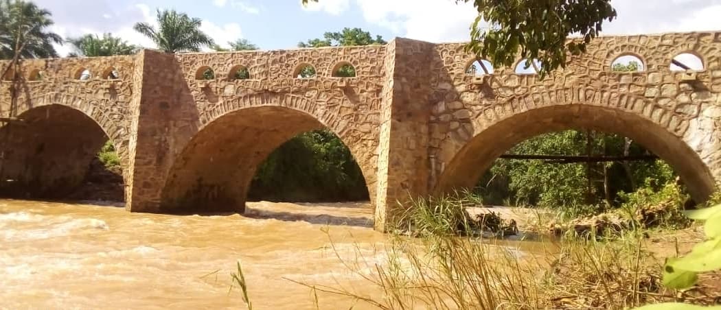 The completed Nyamihanga bridge: three stone arches over the river